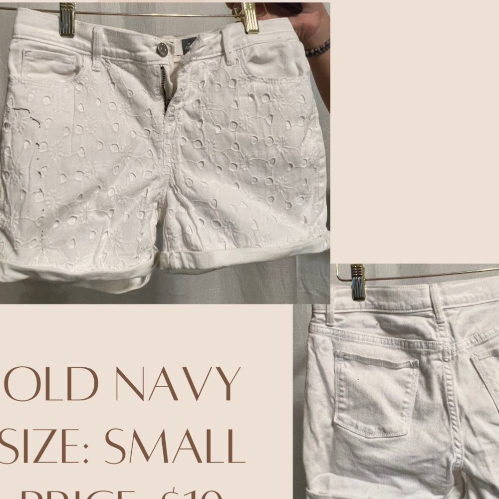Small white jean shorts with flower pattern on the front. Pockets on both sides